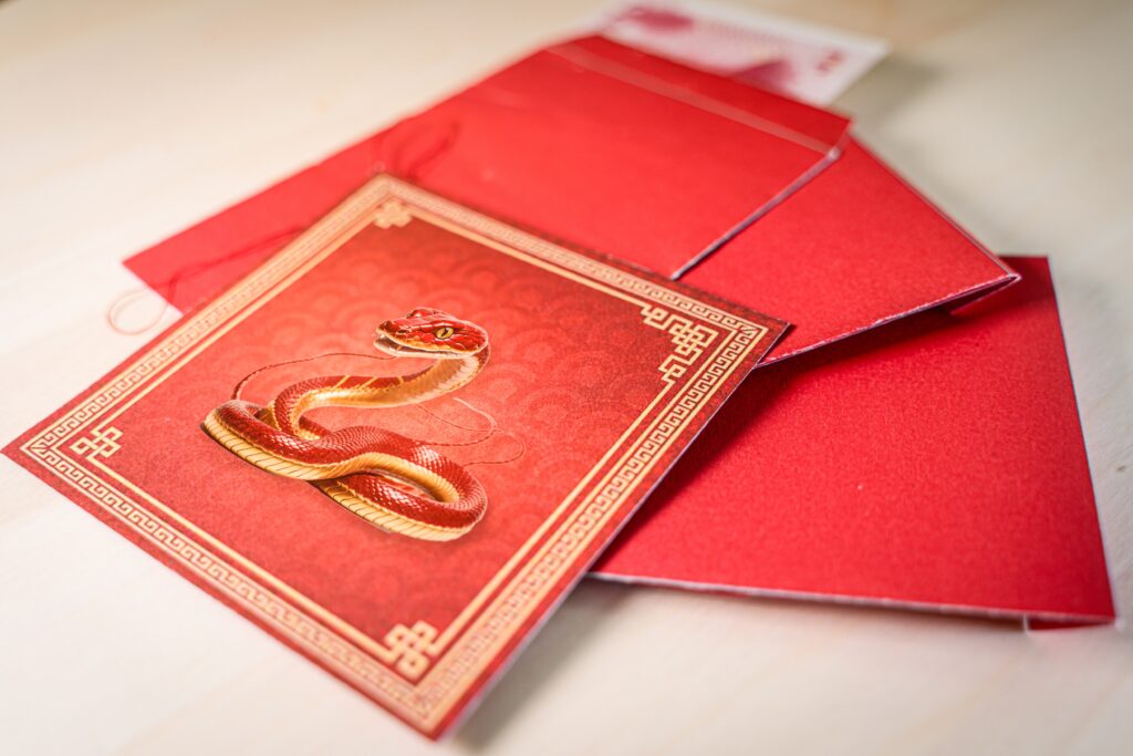 Chinese new year decoration with red envelopes and a snake. New Year of the Snake in the lunar calendar