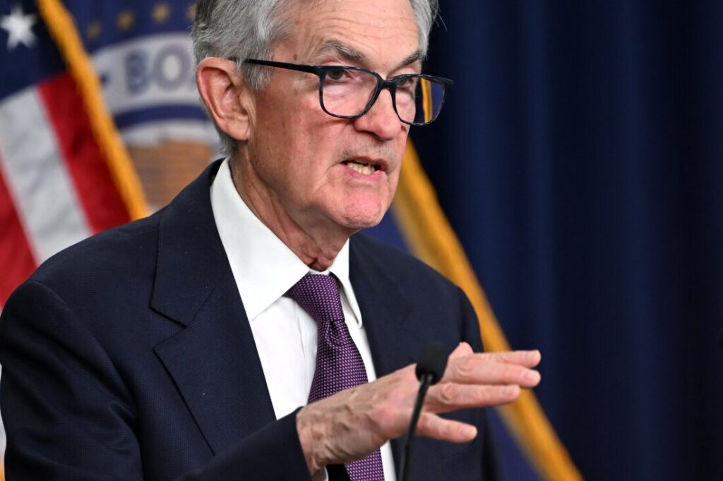 US Federal Reserve Chairman Jerome Powell gestures as he speaks at a press conference after the Monetary Policy Committee meeting in Washington, DC, on December 18, 2024. The US Federal Reserve cut interest rates by a quarter point December 18 and signaled a slower pace of cuts ahead, amid uncertainty about inflation and US President-elect Donald Trump's economic plans. Policymakers voted 11-to-1 to lower the central bank's key lending rate to between 4.25 percent and 4.50 percent, the Fed announced in a statement. They also penciled in just two quarter-point rate cuts for next year, and sharply hiked their inflation outlook for 2025. (Photo by ANDREW CABALLERO-REYNOLDS / AFP) (Photo by ANDREW CABALLERO-REYNOLDS/AFP via Getty Images)