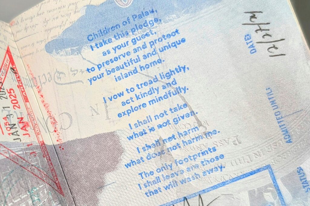 The ‘Palau Pledge’ committing to preserve the island nation’s natural resources, appears on a passport page