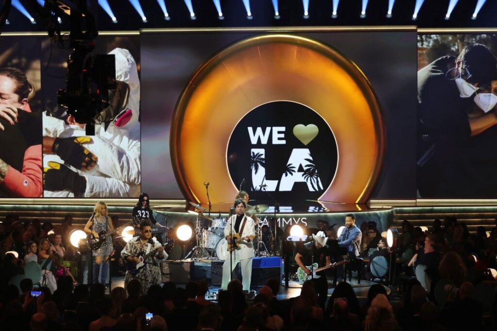 Sheryl Crow, Brittany Howard, St. Vincent, Taylor and Griffin Goldsmith of Dawes, Brad Paisley and John Legend perform the opening act at the Grammy Awards in Los Angeles on Sunday.