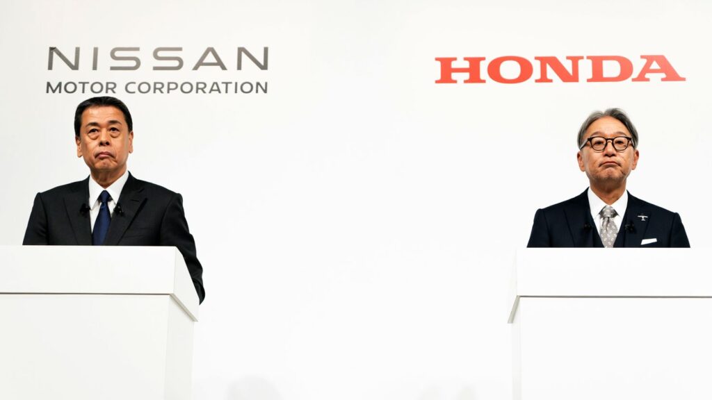 Makoto Uchida, Nissan's president and CEO, and Toshihiro Mibe, president of Honda, hold a joint press conference on their merger talks in Tokyo on December 23, 2024.