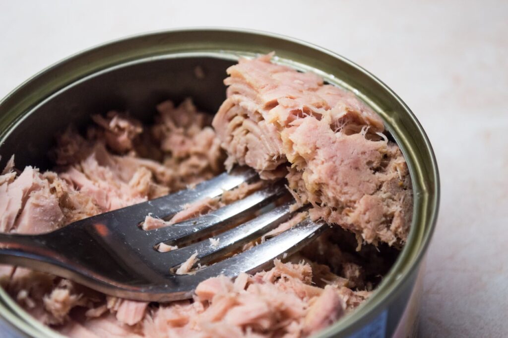 The tuna cans were recalle due to a manufacturing defect on the lids that poses a contamination risk