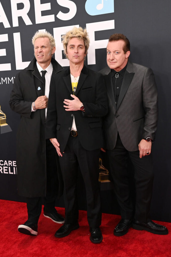 Mike Dirnt, Billie Joe Armstrong, and Tré Cool of Green Day on the red carpet.