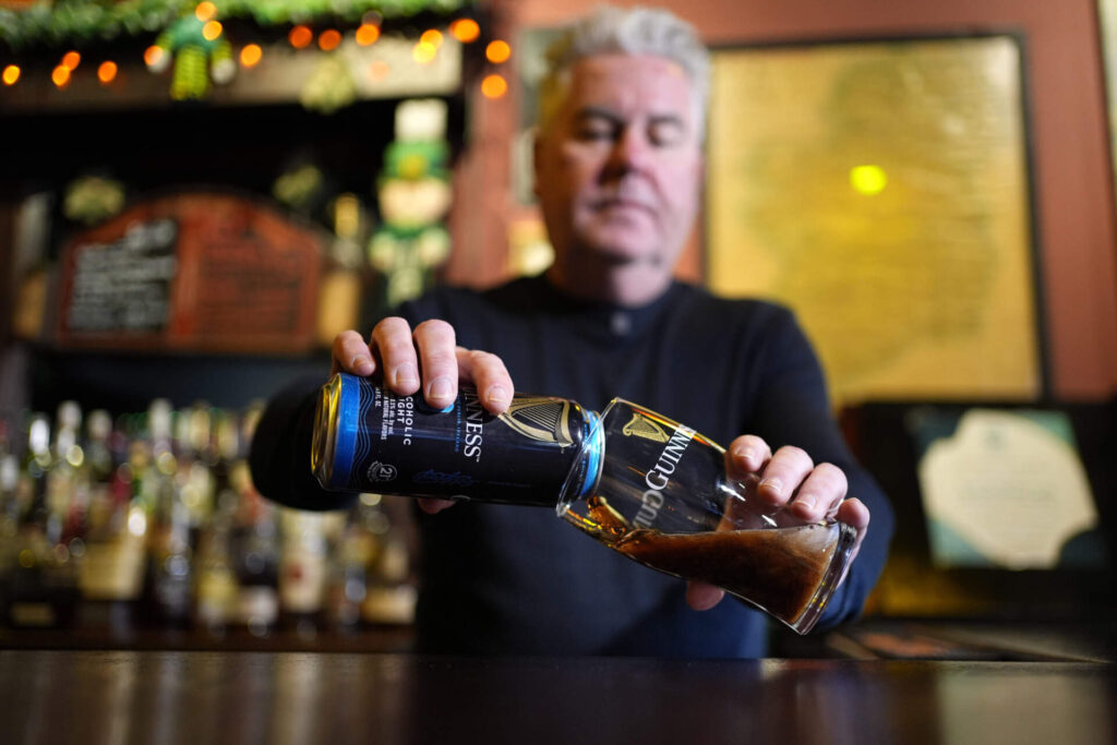 Tommy McCarthy, owner of The Burren, pours a non-alcohol Guinness 0 in Somerville, Mass. (Robert F. Bukaty/AP)