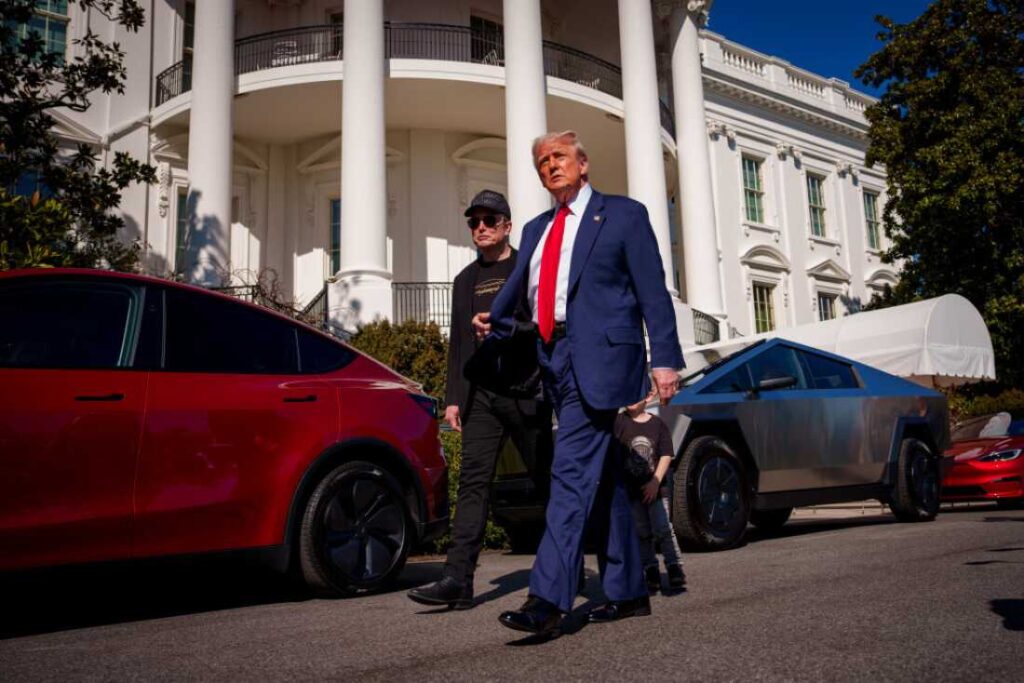 President Trump and White House senior adviser, Tesla and SpaceX CEO Elon Musk depart after looking at Tesla vehicles on the South Lawn of the White House on Tuesday.