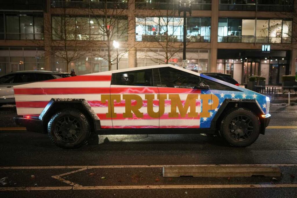 A Tesla Cybertruck emblazoned with "TRUMP" sits in traffic in Washington, D.C., ahead of President Trump's inauguration in January.