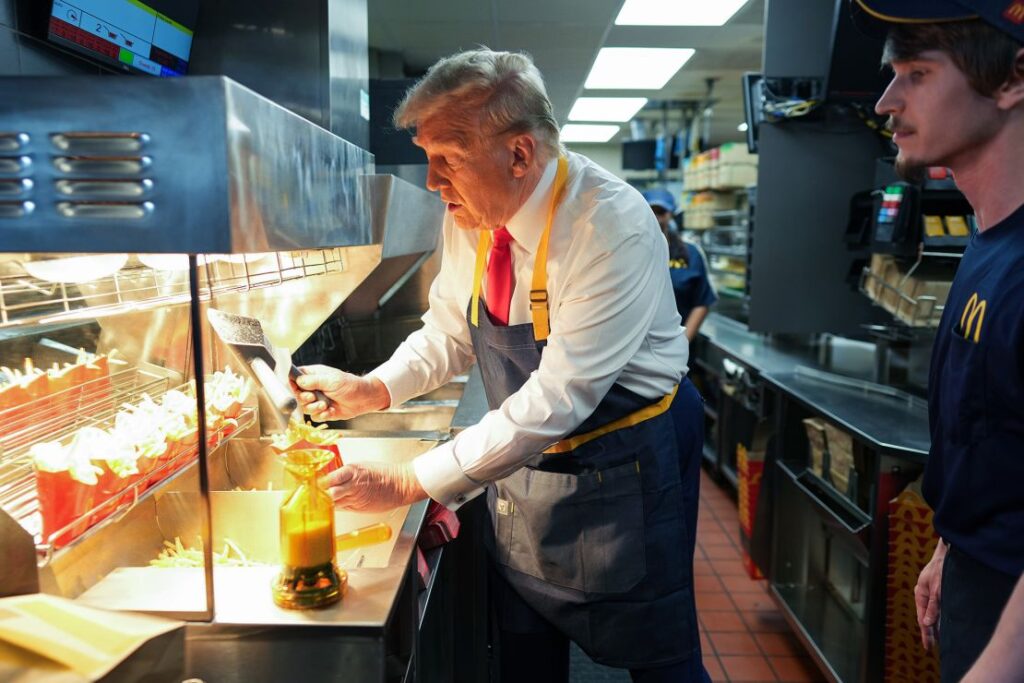 Trump works behind the counter making french fries during a visit to McDonald's restaurant on October 20, 2024, in Feasterville-Trevose, Pennsylvania.