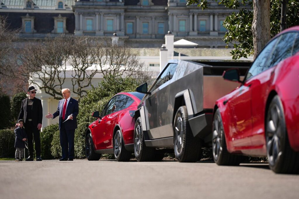 Trump, with Musk, delivers remarks next to a Tesla Model Y, a Cyber Truck and a Model S on the South Lawn of the White House on March 11, 2025 in Washington, DC.